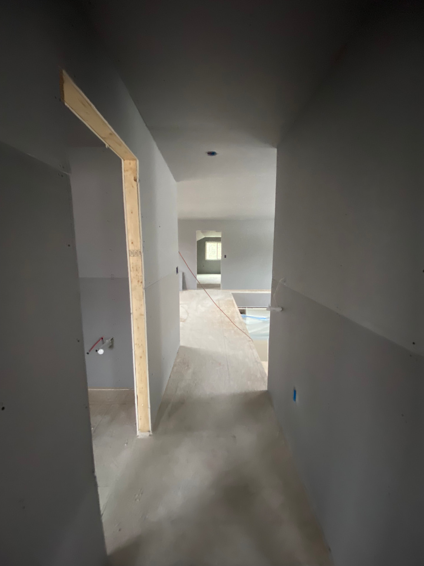 Upstairs hallway after drywall installation