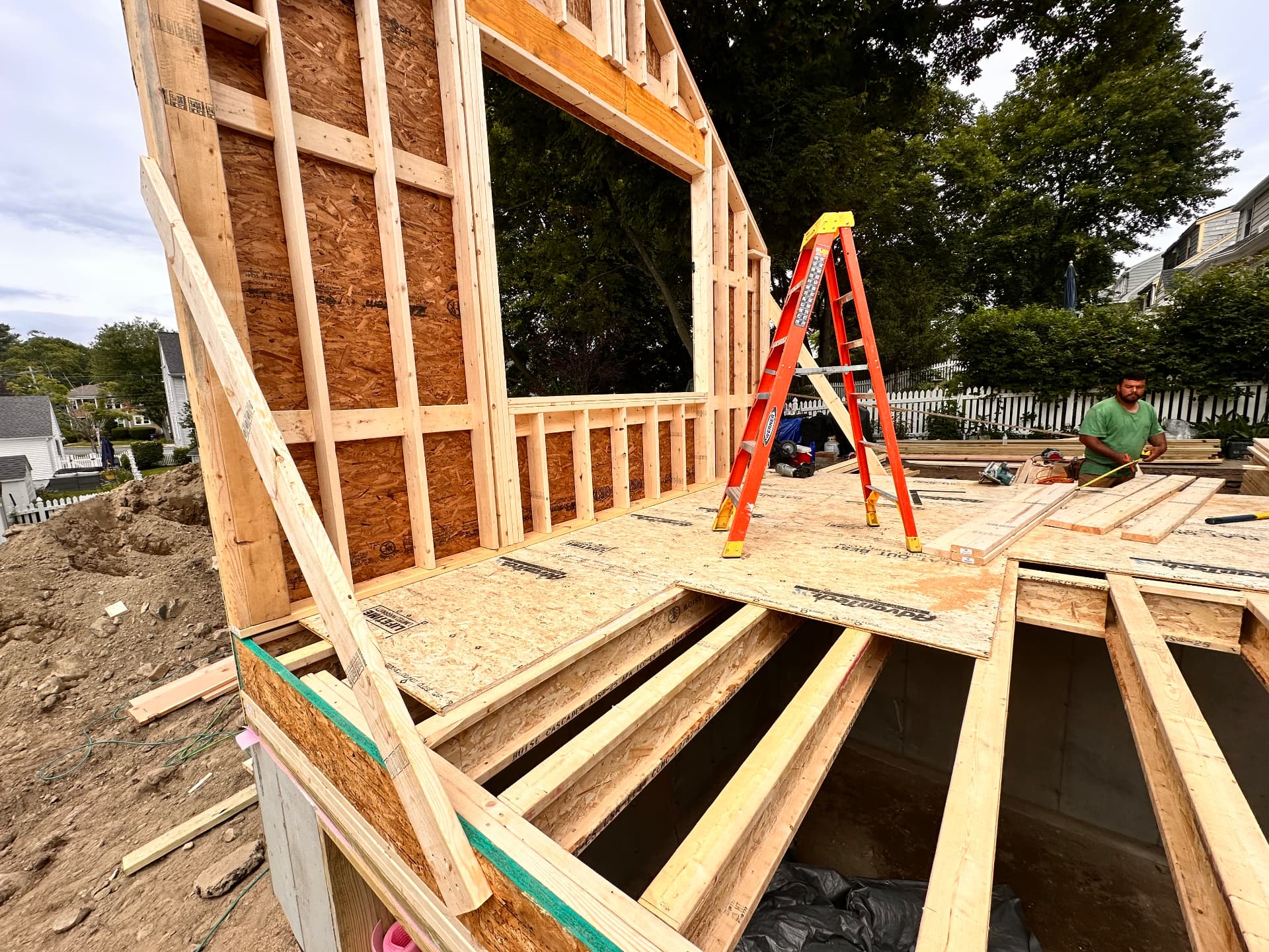 Addition framing rising over the new poured foundation