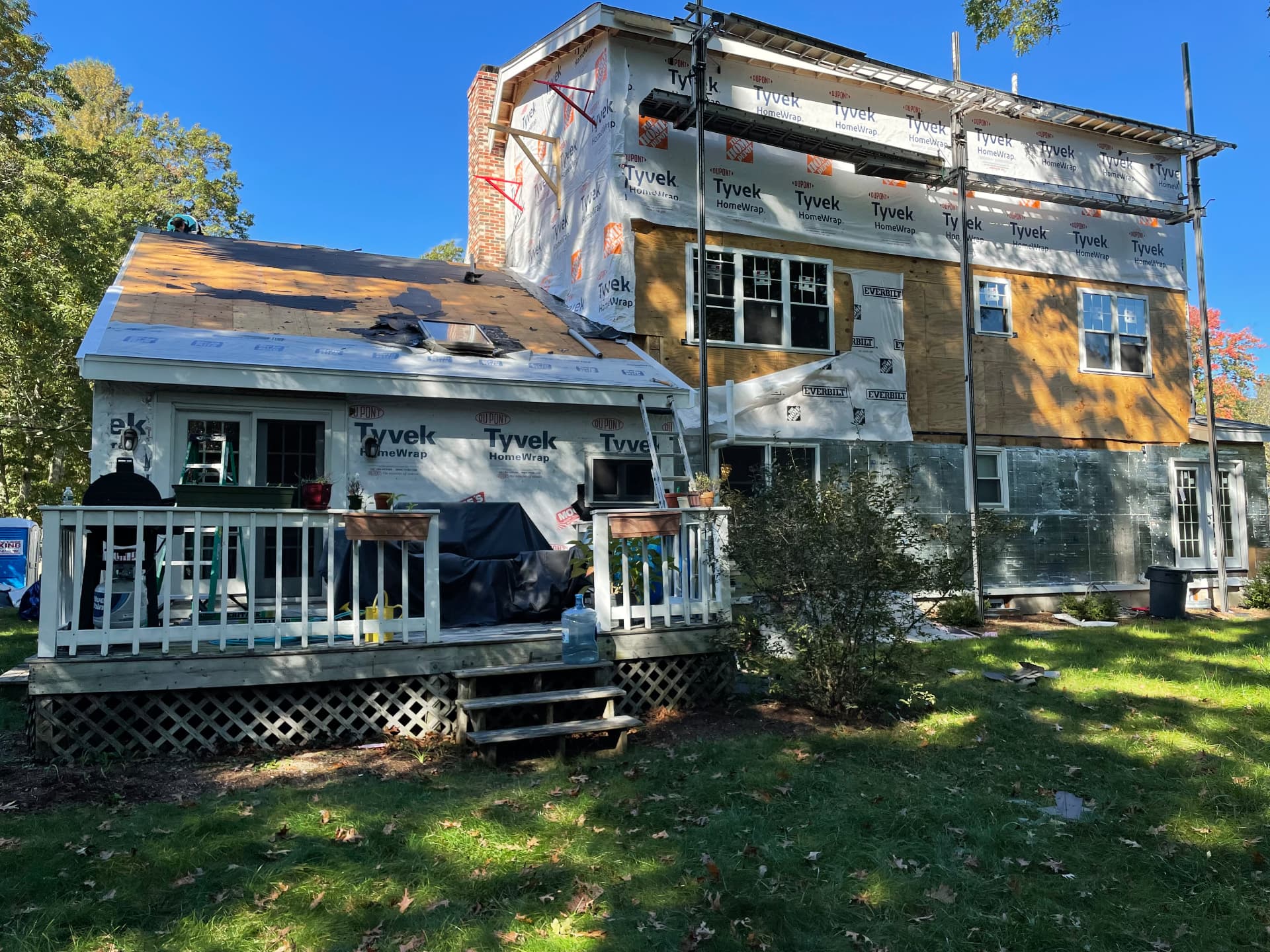 Second-story framing wrapped in house wrap with scaffolding in place