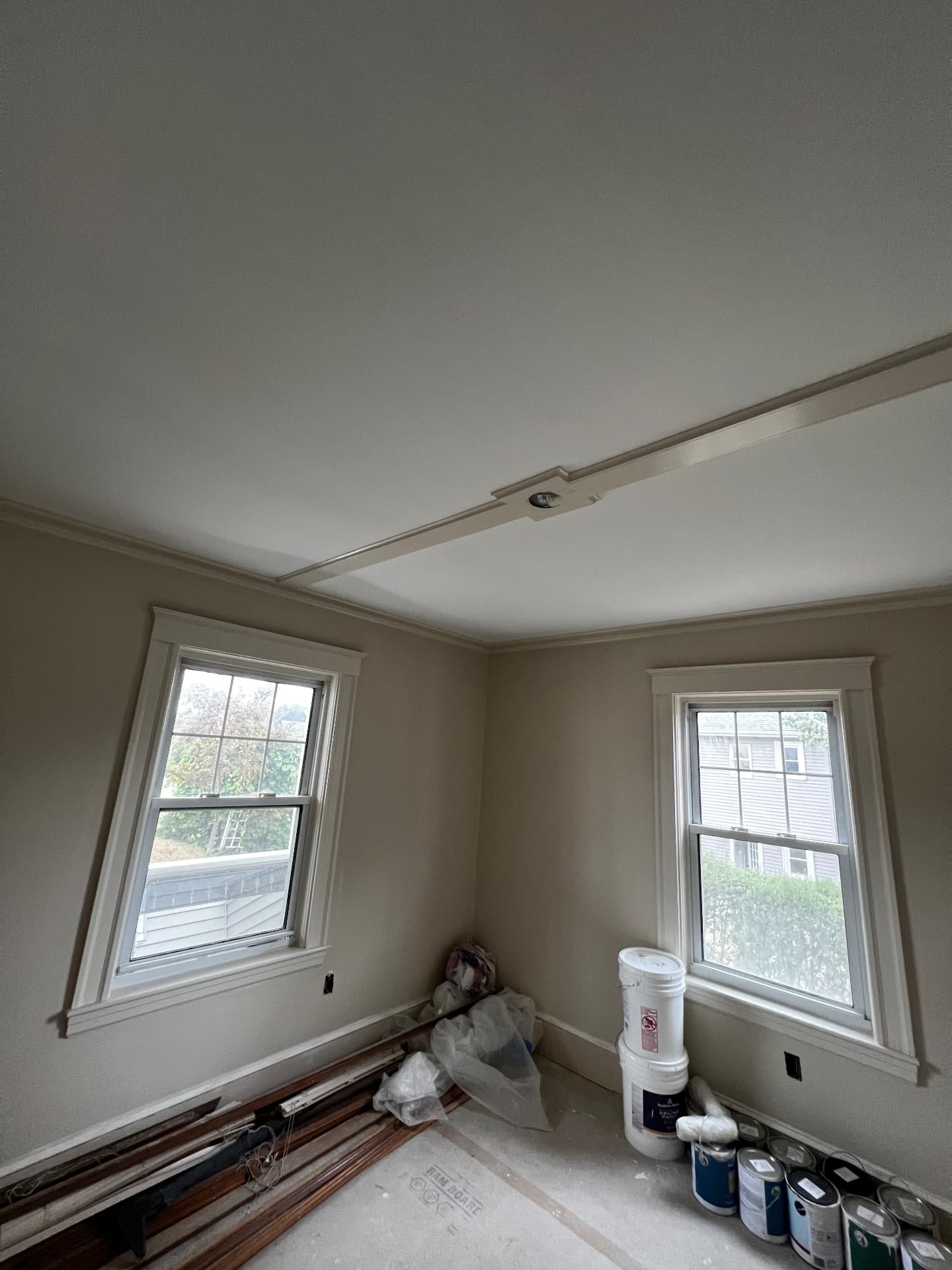Finished interior room with fresh paint, crown molding and new trim