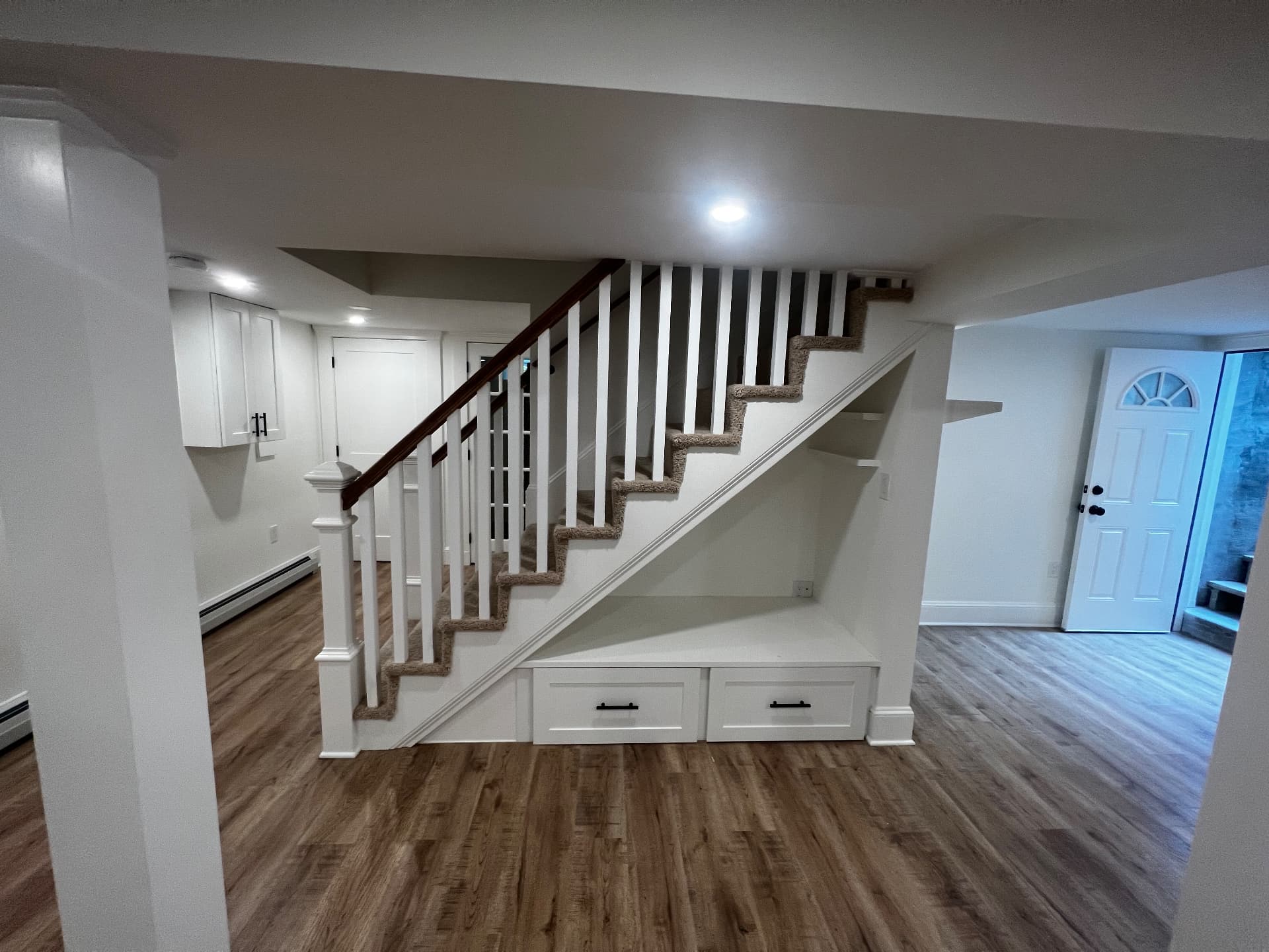 Rebuilt staircase with white balustrade and drawer storage beneath