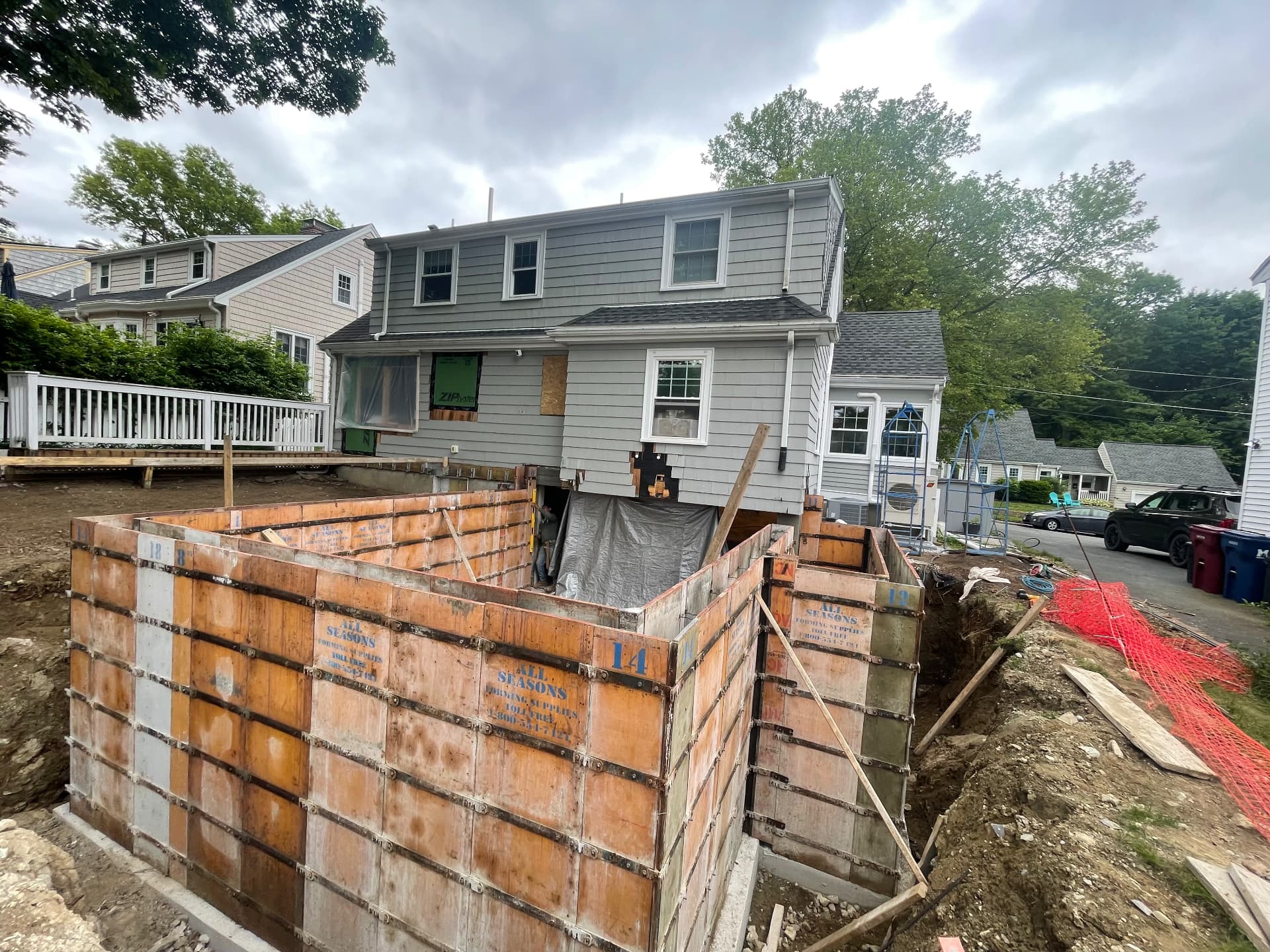 Steel-braced concrete forms set for the new foundation walls