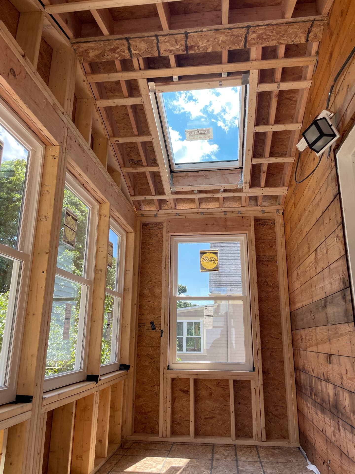 Interior of the framed porch showing the skylight and window openings